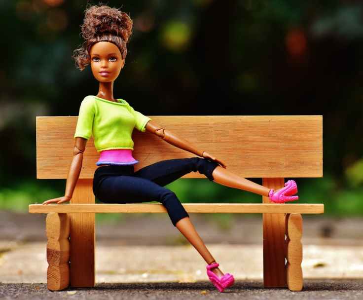 A barbie doll on a bench represents participants in our group
